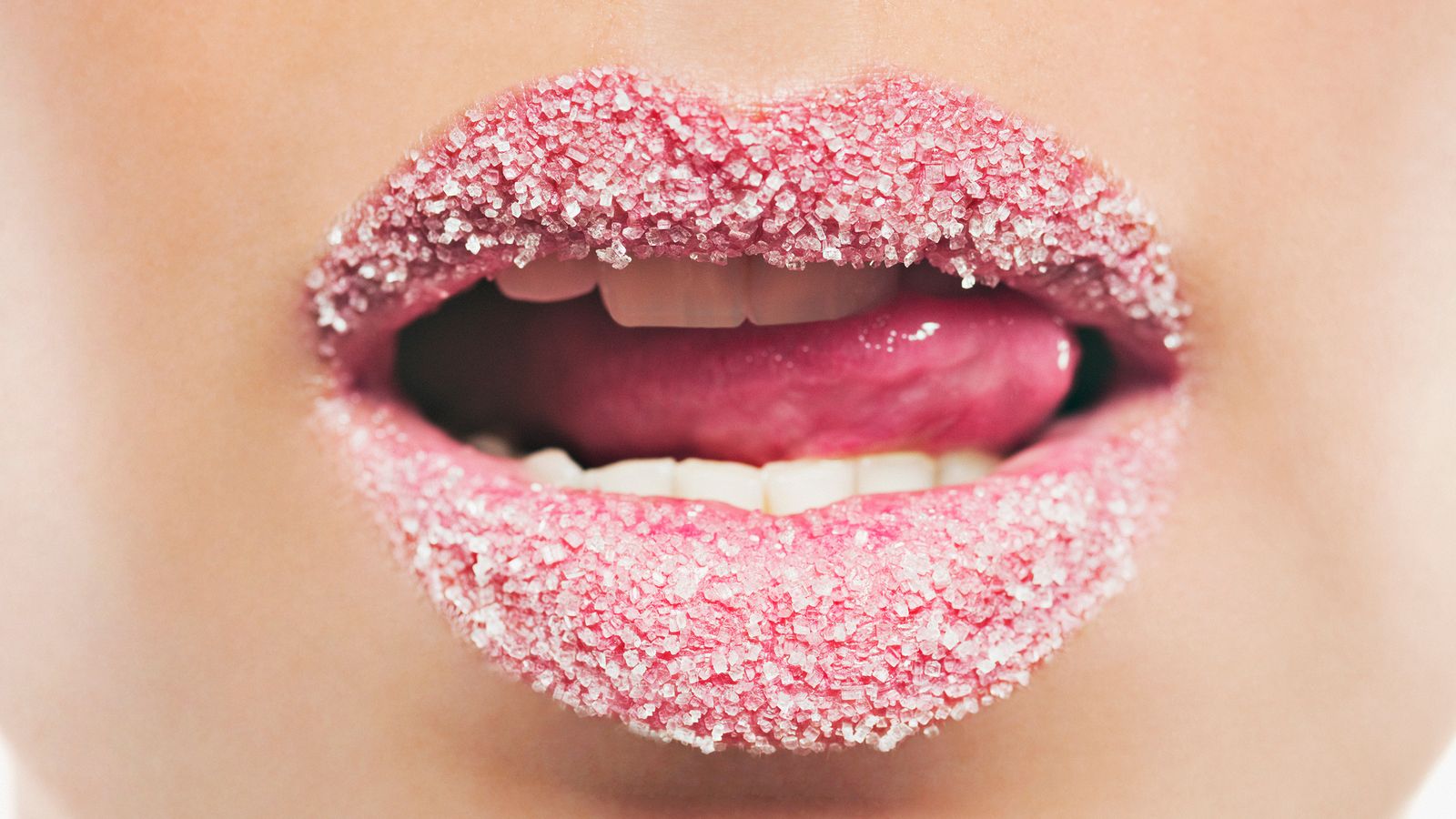 Zucker auf Lippen einer Frau