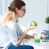 Women is eating an apple